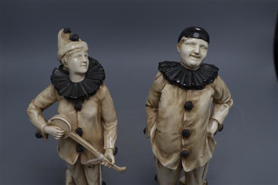 Two rare Bretby Art pottery figures of pierrots, c.1910,